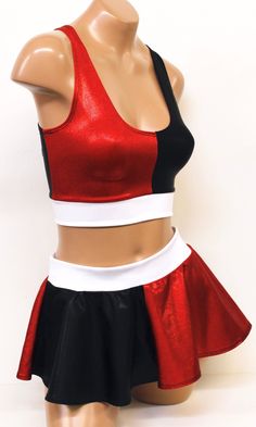 This sexy Harlequin Costume has been inspired by the Evil Jokester's villainess girlfriend. The top is a crop tank in half red, half black metallic, and a white underband. The skirt is a mini circle skirt in half red, half black metallic with a white waistband. Both top and bottom are made from 4-way stretch metallic lycra.ALL HANDMADE in the USA Sugarpuss Size Chart + Care Instructions Shipping Info Mini Circle Skirt, Harlequin Costume, Harley Quinn Halloween Costume, First Halloween Costumes, Harley Quinn Halloween, Star Costume, Justice League Wonder Woman, Harley Quinn Costume, Halloween Costumes Friends