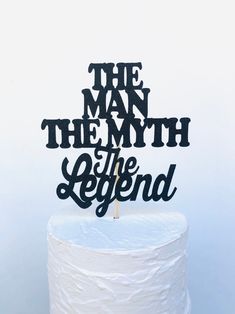 a cake topper that says the man, the myth and the legend