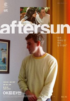 a man standing in front of a window next to a poster with the words aftersunn on it