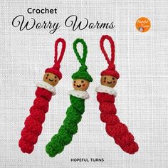 two crocheted christmas ornaments hanging from strings on a white background with text that reads,'crochet worry worms '