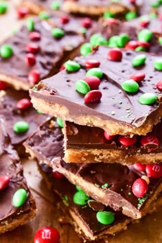 chocolate and candy bars are stacked on top of each other with sprinkles