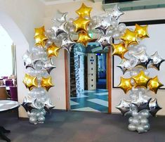 an arch made out of balloons and stars