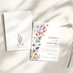 two wedding cards with flowers on them