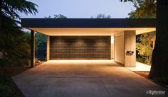 an empty garage is lit up at night