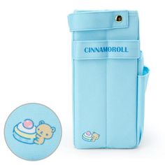 a blue case with a cartoon bear on the front and an image of a cupcake in the back