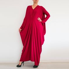 "Oversized draped maxi dress. Relaxed fit. Interesting design. Long sleeves Perfect for plus sizes The color on the photos is Apple Green color from our color chart. The model is 155cm tall and size L/XL. The dress has 3/4 sleeves. The dress is made to order. It can be made in all sizes, including plus sizes. I will need the length from the shoulder to the bottom hem or your total height. -------------------------- This garment is available in XS-3XL sizes Every garment is made for 170 cm (5\"8' Elegant Oversized V-neck Maxi Dress, Billowy V-neck Maxi Dress For Party, Elegant Batwing Sleeve Maxi Dress For Summer, Chic Flowy Dress With Batwing Sleeves, Party Batwing Sleeve Fall Dresses, Fall Party Dress With Batwing Sleeves, Flowy Floor-length Maxi Dress With Draped Sleeves, Elegant Evening Maxi Dress With Batwing Sleeves, Flowy Long Sleeve Maxi Dress For Evening