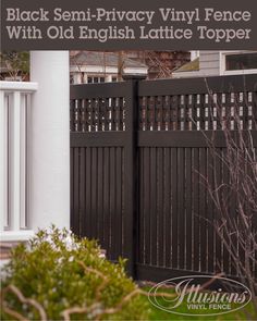 black semi - privacy vinyl fence with old english lattice topper in front of house