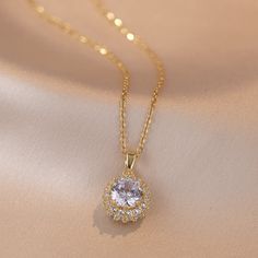 Material: Titanium Steel Fashion Element: Petals Style: Affordable luxury style Elegant Rhinestone Clavicle Chain Necklace, Formal Rhinestone Clavicle Necklace, Elegant Rhinestone Clavicle Chain Necklace With Round Pendant, Elegant Rhinestone Necklace With Round Pendant, Rhinestone Necklace With Round Pendant For Party, Party Rhinestone Necklace With Round Pendant, Wedding Rhinestone Pendant Necklace With Clavicle Chain, Wedding Rhinestone Clavicle Chain Necklace, Gold Rhinestone Clavicle Necklace