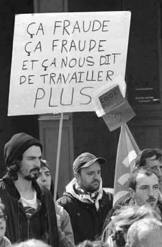 black and white photograph of protestors holding signs