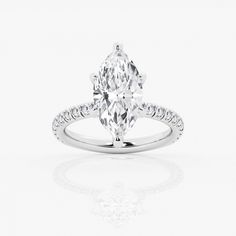 an oval cut engagement ring with diamond accents