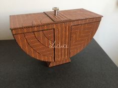 a wooden box sitting on top of a black floor