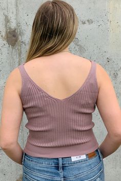 Must have layering piece featuring a front and back V-neck. Lightweight soft fabric with a stretchy, ribbed design for an easy fit. Short length - almost a crop. Mocha color. 50% Viscose / 28% Polyester / 22% Nylon Fit Notes: Junior size brand that runs small. Elizabeth is modeling a size Small. ------------ NOTE: All items with prices ending in .19 are considered closeout/clearance items that we will not be restocking. Last chance -- get it for a steal! (No returns or exchanges on .19 priced FI Stretch Ribbed Knit Top With V-neck, Seamless Stretch V-neck Knit Top, Stretch V-neck Brown Tank Top, Brown Ribbed Cropped Top, Trendy V-neck Crop Top For Layering, Trendy V-neck Crop Top, Chic Brown Seamless Tops, Brown Seamless V-neck Top, Casual V-neck Crop Top For Layering