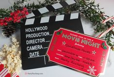 a christmas movie ticket sitting on top of a table next to some candy canes