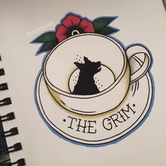 a notebook with the words, the grim written on it and a dog in a cup