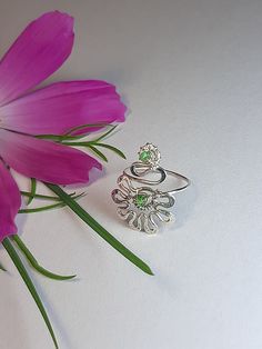 Flower toe ring. Delicate ring for fingers or toes--petite flower. Versatile and fun. Wear it as a foot ring with flip-flops or strappy heels. Wear it as a midi ring between your knuckles. Wear it folded and mixed with other rings to create new combinations. Choice of silver or bronze finish. Perfect little gift. The ring is made in Wire wrap technique, elements of coinage, from silver 925, copper or bronze wire with natural rhodochrosite, turquoise, malachite, and also you can order the ring with other stones, pre-negotiate with me. The ring is artificially aged chemically, polished and coated with protective varnish. The ring size is adjustable.  In the package You will receive one ring for the toe, which select from the options. Pay attention If You like thicker and more powerful rings, May Birthstone Flower Ring As A Gift, Delicate Adjustable Rings For Spring, Adjustable Silver Toe Ring With Flower Design, Adjustable Sterling Silver Ring For Spring, Adjustable Rings For Spring Promise Ring, Silver Flower Toe Ring, Spring Open Ring For Promise, Spring Promise Ring With Open Ring Shape, Spring Promise Ring With Open Design