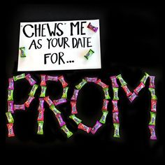 the word prom spelled with candy in front of a sign that reads chews me as your date for prom