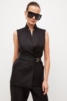 Tailored Linen Blend Sleeveless Belted Jacket | Karen Millen Fitted Sleeveless Blouse Vest For Layering, Tailored Sleeveless Summer Vest, Elegant Notch Lapel Tops For Spring, Workwear Vest With Pockets, Elegant Spring Tops With Notch Lapel, Versatile Sleeveless Outerwear For Work, Fitted Spring Vest With Lapel Collar, Chic Vest With Lapel Collar Outerwear, Chic Fitted Vest With Lapel Collar