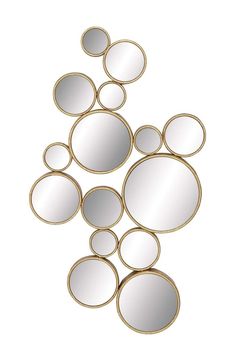 a group of mirrors sitting on top of a white wall next to each other in the shape of circles