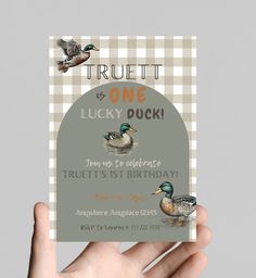 a person holding up a birthday card with two ducks on it and the words, truett is one lucky duck