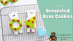 decorated bear cookies are on a cooling rack