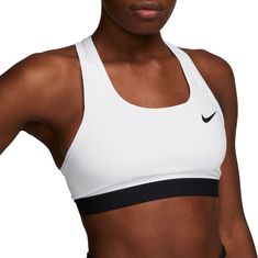 The Nike Dri-FIT Swoosh Sports Bra gives you the kind of support you know you can count on. This non-padded style is made of soft, smooth fabric and an exposed elastic band at the bottom that helps keep everything in place. Sweat-wicking technology helps you stay dry and comfortable. This product is made with at least 50% recycled polyester fibers. Fit & Design: Exposed elastic band resists slipping so it stays in place Nike Dri-FIT technology moves sweat away from your skin for quicker evaporat Sports Bra Design, Medium Support Sports Bra, Gray Sports Bra, Womens Sports, White Sports Bra, Nike Sports Bra, Padded Sports Bra, Racerback Sports Bra, Swoosh Logo