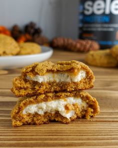 two cookies stacked on top of each other with marshmallows in the background