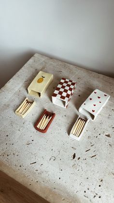 four matches are sitting on top of a table