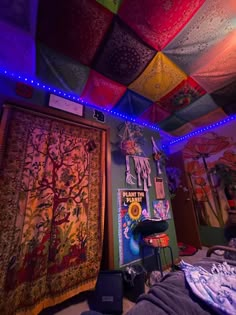 the room is decorated with colorful lights and rugs on the ceiling, along with various decorations