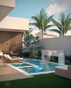 an outdoor swimming pool surrounded by palm trees