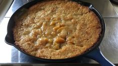 a close up of a skillet on a stove top with food in the middle