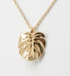 Inspired by my very own Monstera deliciosa, this gorgeous Monstera Deliciosa leaf necklace is plated in White Gold and has a Mirror- like finish. This is a stunning necklace that makes the perfect gift the nature enthusiast. | Inspired by my very own Monstera deliciosa, this gorgeous Monstera Deliciosa leaf necklace is plated in White Gold and has a Mirror- like finish. This is a stunning necklace that makes the perfect gift the nature enthusiast. | 1-800-Flowers Gifts Delivery Monstera Delicios Leaf-shaped Yellow Gold Necklace, Leaf-shaped Yellow Gold Necklace For Gift, Gold Plated Leaf-shaped Jewelry, Gold Plated Leaf-shaped Jewelry For Gifts, Nature Enthusiast, Flowers Gifts, Monstera Deliciosa, Delivery Gifts, Necklace Charm