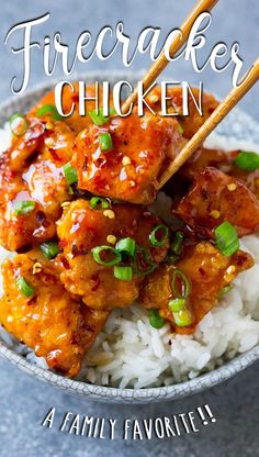 a bowl filled with chicken and rice on top of a blue tablecloth next to chopsticks