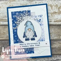 a christmas card with a gnome and snowflakes