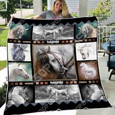 a woman holding up a blanket with pictures of horses on it in black and white