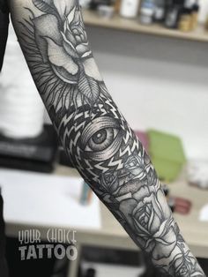 a person with a black and white tattoo on their arm