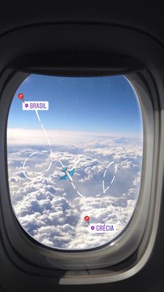 the view from an airplane window looking out at clouds and planes flying in the sky