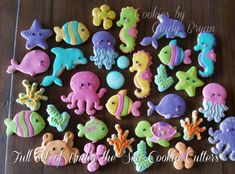 there are many different types of cookies on the table with words above them that say, under the sea