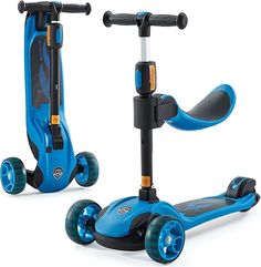 two blue scooters sitting next to each other on a white surface with wheels