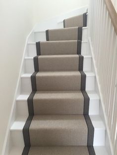 a set of stairs with carpet on the bottom