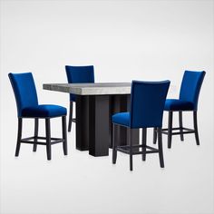 a table with four chairs around it and a marble top in the middle is surrounded by blue upholstered barstools