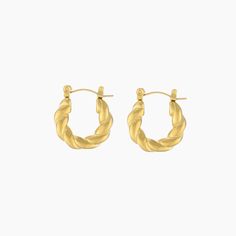 Make a statement with our Twist Hoop Earrings! Crafted from 18K gold plating, this piece is made to last. Add these twist hoop earrings to your gold jewelry collection today.Thickness: 3.4mm Diameter: 20mm Gold Plated Hoop Earrings With A Modern Twist, Modern Twist Gold Plated Hoop Earrings, Modern Twist Gold-plated Hoop Earrings, Twisted Gold Plated Yellow Gold Hoop Earrings, Twisted Gold Plated Hoop Earrings, Gold Tarnish Resistant Huggie Earrings With Modern Twist, Twisted Yellow Gold Hoop Earrings, Tarnish Resistant, Gold Huggie Earrings With Modern Twist, Tarnish Resistant, Gold Twisted Hoop Earrings Minimalist Style