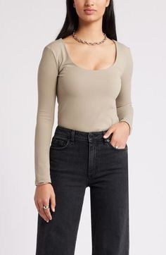 The soft, stretchy fabric of this scoop-neck top contours to your silhouette, allowing for easy layering so you can effortlessly transition from the office to evening. 19" length (size Medium) Scoop neck lined Long sleeves 75% nylon, 25% spandex Machine wash, tumble dry Imported Elegant Scoop Neck Top For Everyday, Chic Solid Tops With Scoop Back, Chic Solid Color Tops With Scoop Back, Sleek Scoop Neck Tops With Minimal Stretch, Sleek Top With Scoop Neck And Minimal Stretch, Sleek Tops With Scoop Neck And Minimal Stretch, Sleek Solid Color Scoop Neck Top, Scoop Neck Tops For Workwear, Scoop Neck Top For Work