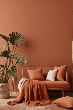 a living room with an orange couch and potted plant