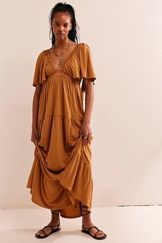 Forever free and flowy, this effortless maxi dress from our free-est collection is featured in a V-neck, tiered silhouette with flutter sleeves for added shape. * Soft, textured fabrication * Elastic empire waist * Effortless, pull-on style | La La Maxi Dress by free-est at Free People in Brown, Size: S Maternity Boho Dress, Free Size Dress, Gauze Maxi Dress, Rust Dress, Style Maxi Dress, Shop Maxi Dresses, Flutter Sleeves, Dress Ideas, Cashew