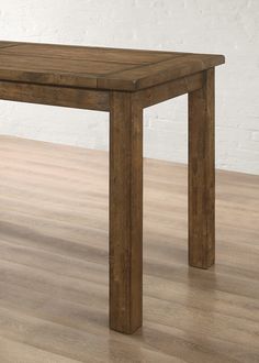 a wooden table sitting on top of a hard wood floor