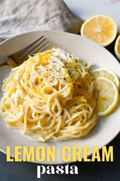 a white plate topped with lemon cream pasta