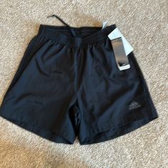 5” Running Shorts With Side Pockets Spring Adidas Moisture-wicking Bottoms, Adidas Bottoms For Gym In Spring, Adidas Gym Bottoms For Spring, Spring Adidas Gym Bottoms, Black Moisture-wicking Shorts For Spring, Adidas Gym Bottoms With Built-in Shorts, Adidas Moisture-wicking Shorts, Adidas Gym Bottoms Short Length, Adidas Workout Bottoms With Built-in Shorts