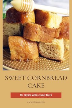 sweet cornbread cake on a plate with honey drizzled over the top