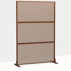 a brown metal screen with white dots on it