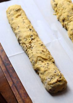 two pieces of bread sitting on top of parchment paper